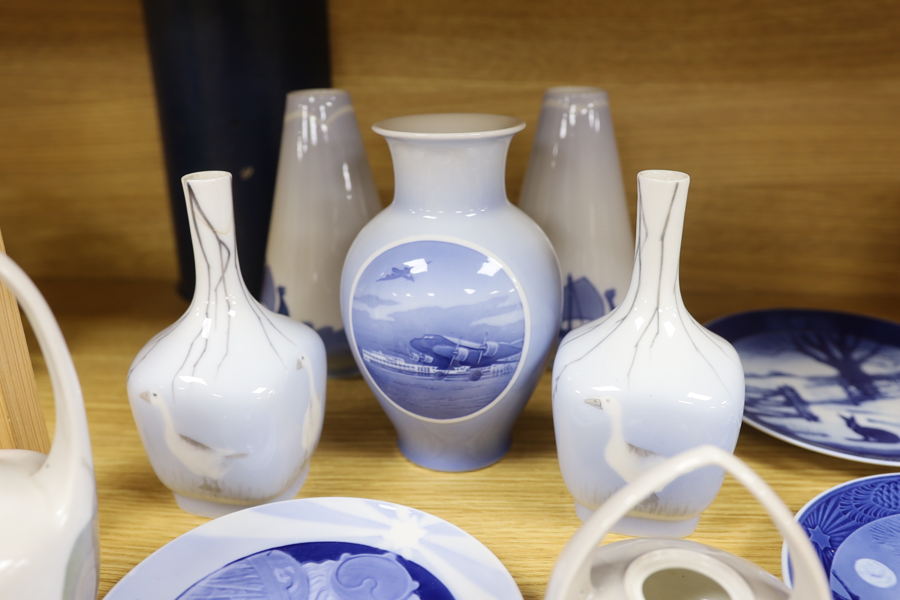 Two pairs of Royal Copenhagen vases, three others and three plates, with decorations including ships, geese, snail, etc (9), 18cm high